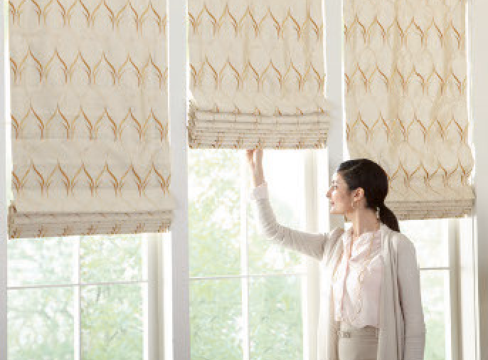 Fabric Roman Shades Covering a Kitchen Window